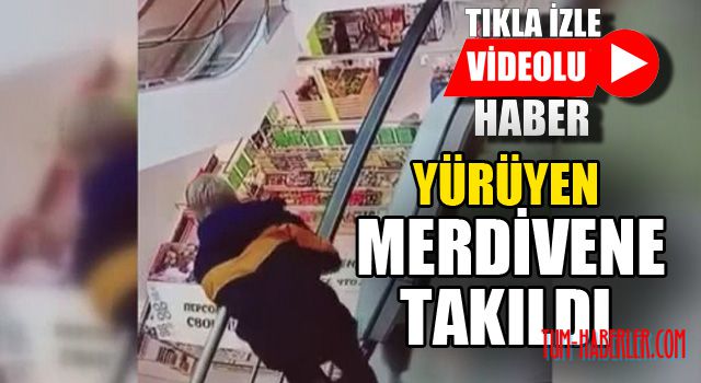 Yürüyen merdivenin bandına takıldı, aşağıya düştü